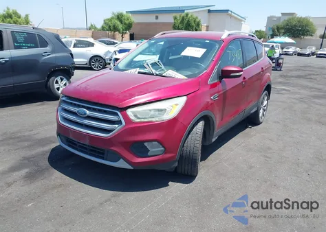 2017 Ford Escape Titanium z USA, uszkodzony, nr VIN 1FMCU0J9XHUB30897